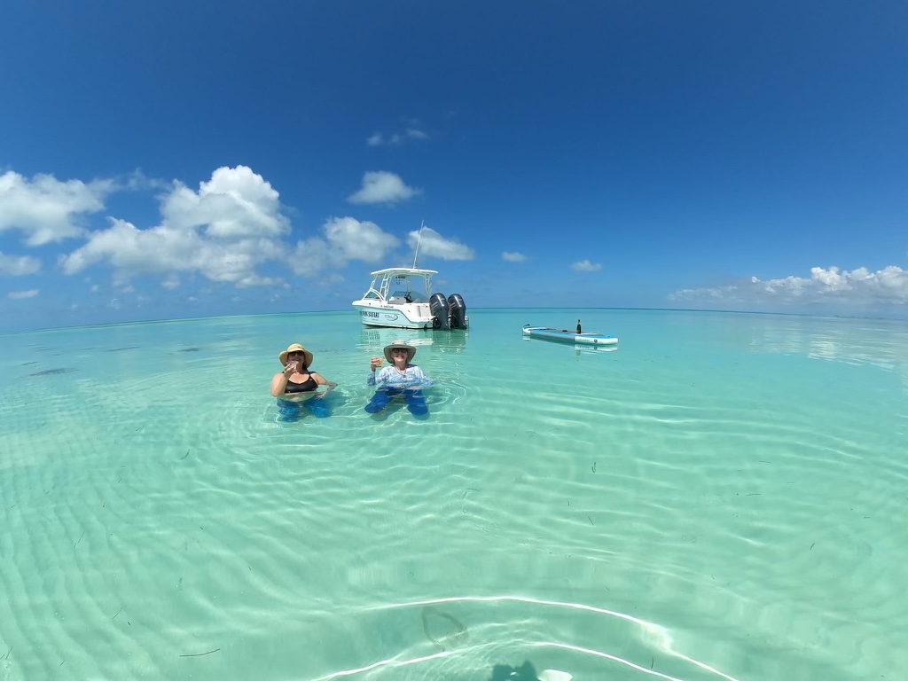 couple sitting in the ocean